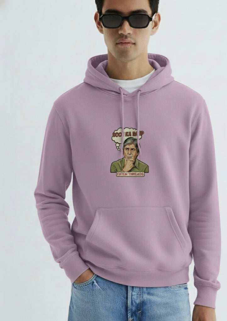 Person wearing a light purple hoodie with a graphic design on a plain background
